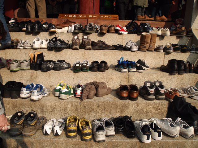 shoes all lined up on the steps of the pavilion